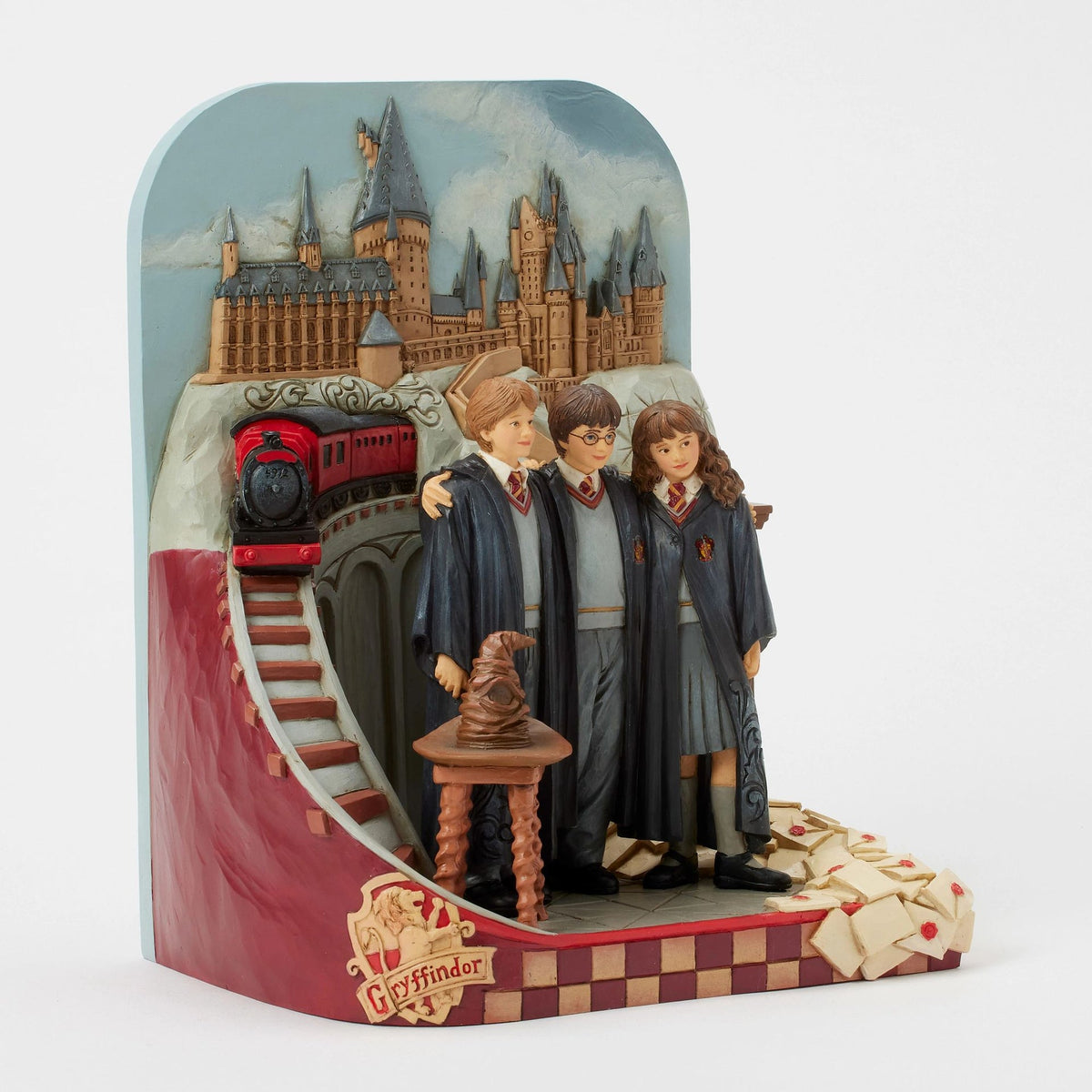 Figura Harry Potter: Trío frente al castillo de Hogwarts