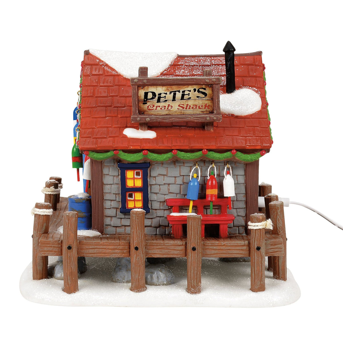 Edificio iluminado de Pete: Navidad costera