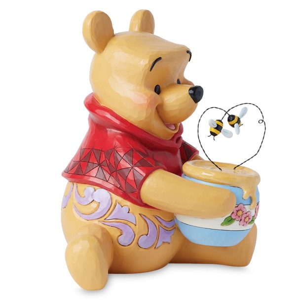 Figura de Winnie the Pooh con tarro de miel