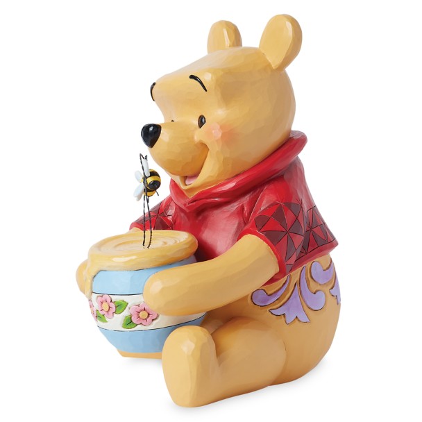 Figura de Winnie the Pooh con tarro de miel