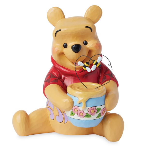 Figura de Winnie the Pooh con tarro de miel