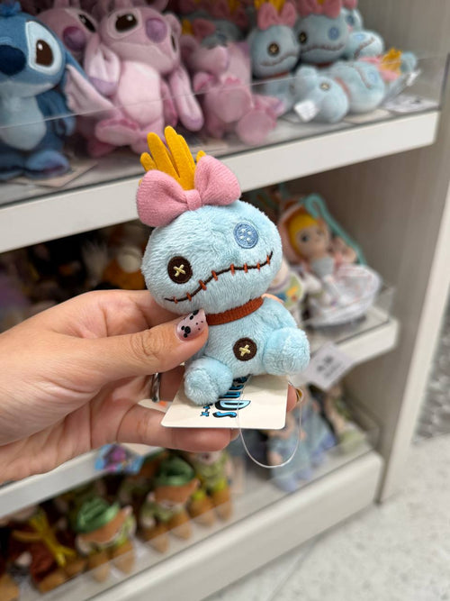 Peluche Criatura Azul con Lazo Rosado