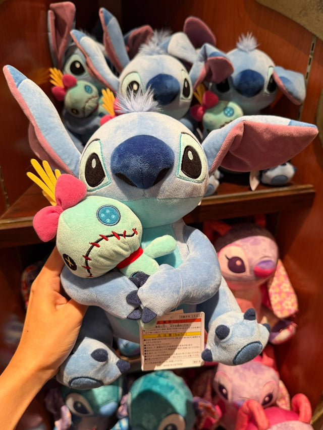 Peluche Stitch con Muñeco Verde